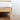 detailed shot of wooden leg of beautiful platform bed by Carolina leg co
